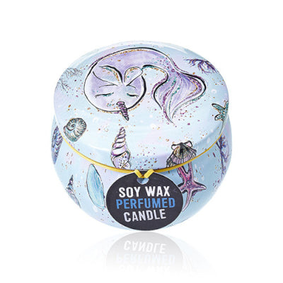 Soy wax perfumed candle in a decorative tin with mermaid design on a white background