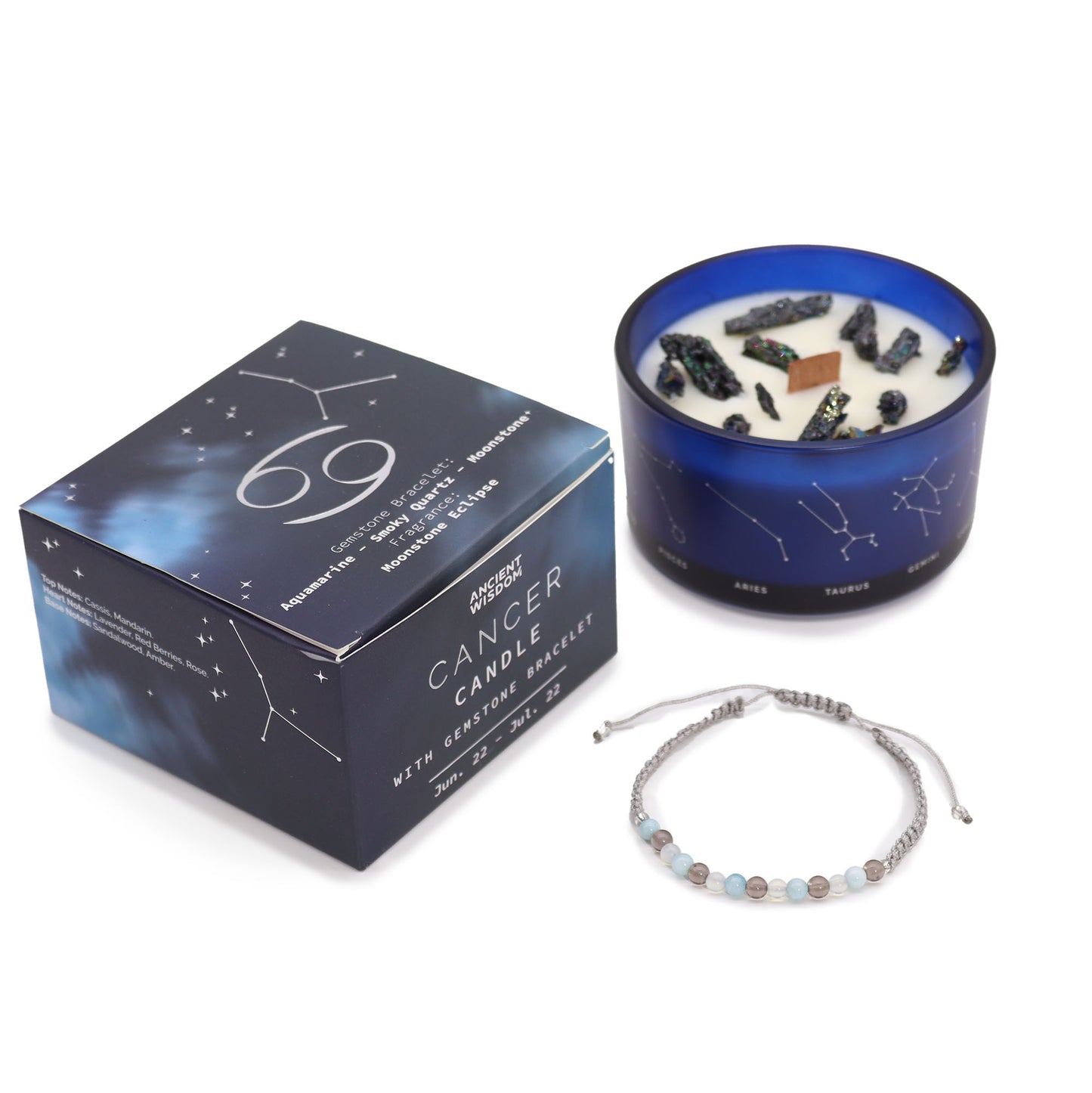 A set including a blue container candle with a white wax, adorned with black and gold designs, and a gemstone bracelet with a box packaging featuring Cancer zodiac signs and constellations.