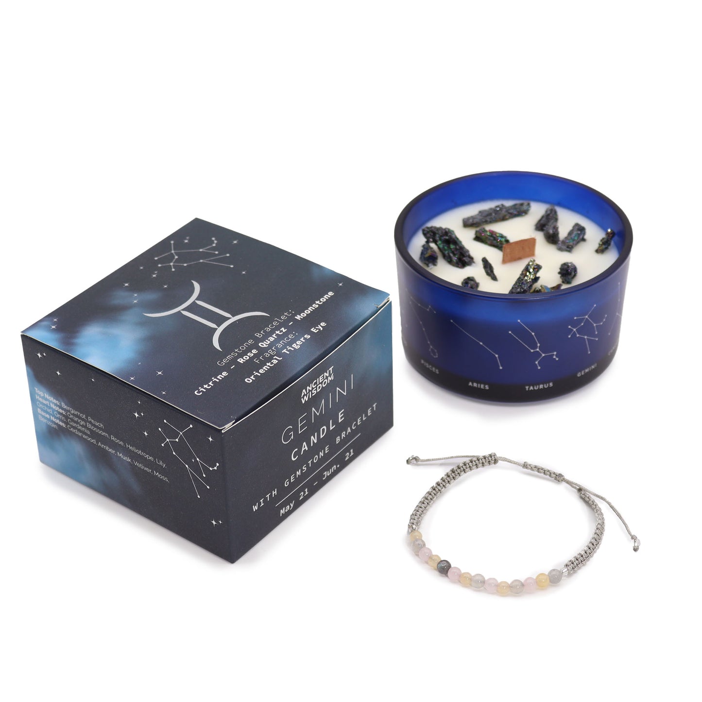 A set including a blue container candle with gemstones inside, and a gemstone bracelet, with a box that has astrological symbols on it.