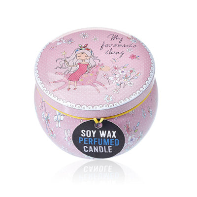 Pink soy wax perfumed candle with fairy design on a white background