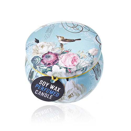 Soy wax perfumed candle in decorative packaging with floral design