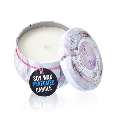 Soy wax perfumed candle in a tin with a decorative label on a white background