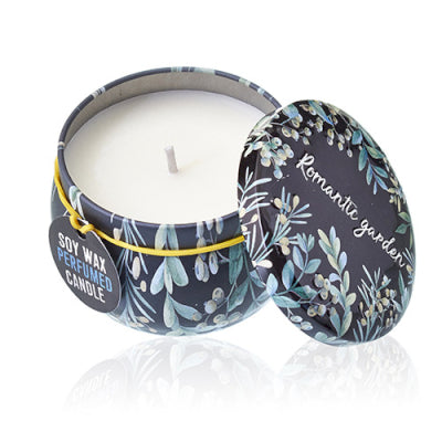 Soy wax candle in a decorative tin with floral design on a white background