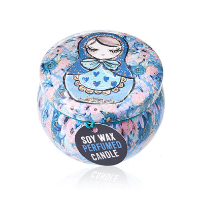Perfumed candle in a decorative tin with floral and character design on a white background