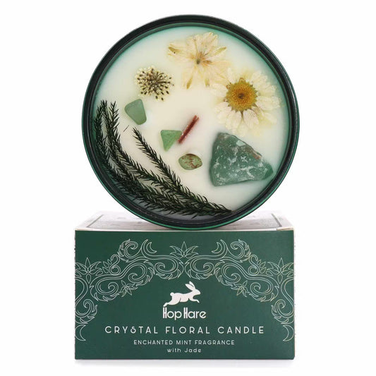 Crystal floral candle with natural elements on a white background