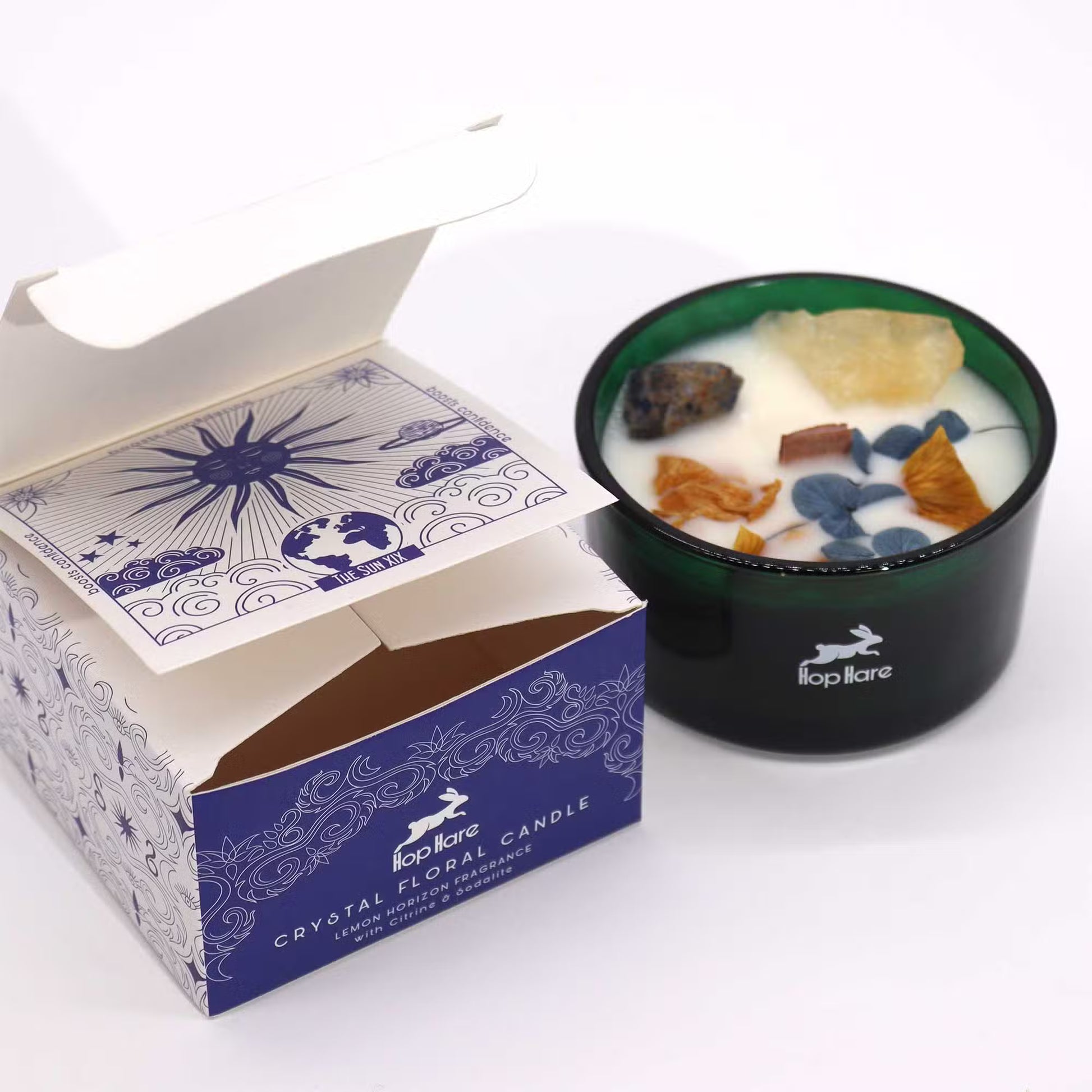 Crystal floral candle with decorative packaging on a white background