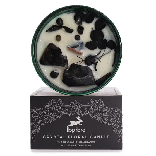 Crystal floral candle with black obsidian on a decorative box, featuring the brand 'Topillare'.