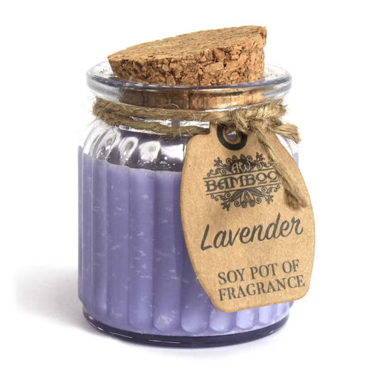 Soy pot of lavender fragrance with cork lid and wooden tag on a white background