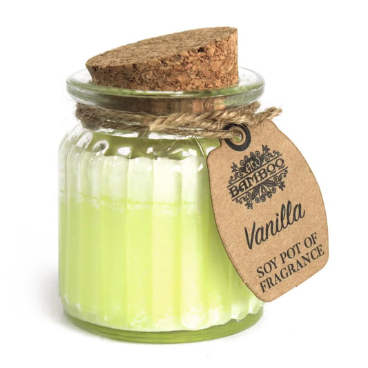 Scented candle in a glass jar with a cork lid and 'Bamboo' brand tag on a white background