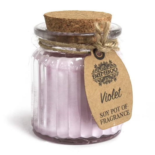 Jar of purple candles with a cork lid and 'Bamboo' brand tag on a white background