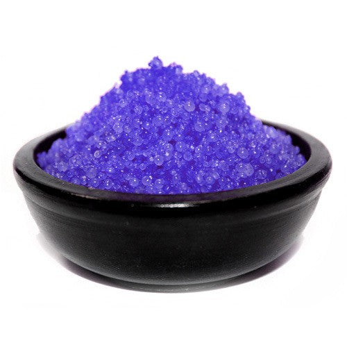 A black bowl filled with purple simmering granules.