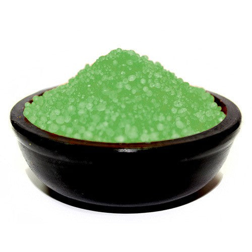 A bowl of green simmering granules with the scent of Hollyberry & Mistletoe.