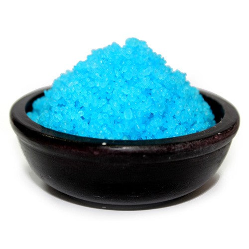 A bowl of blue simmering granules designed to release a fragrance when burned.